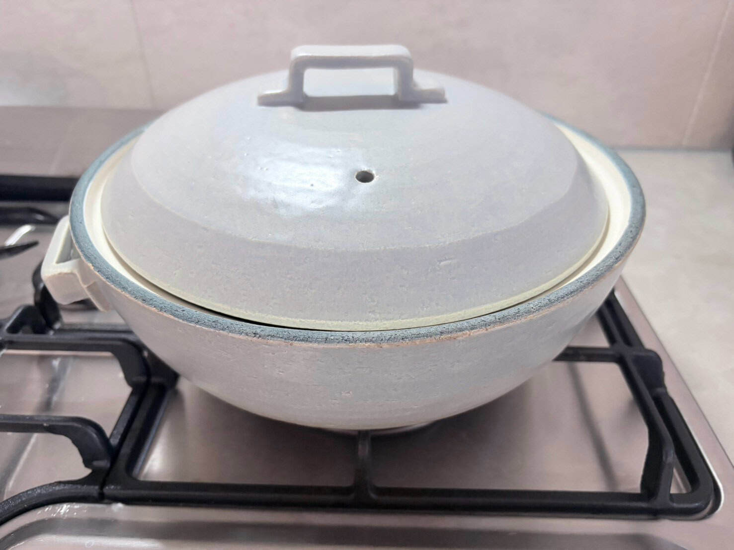 How to season a donabe: a Banko-ware donabe on a gas burner