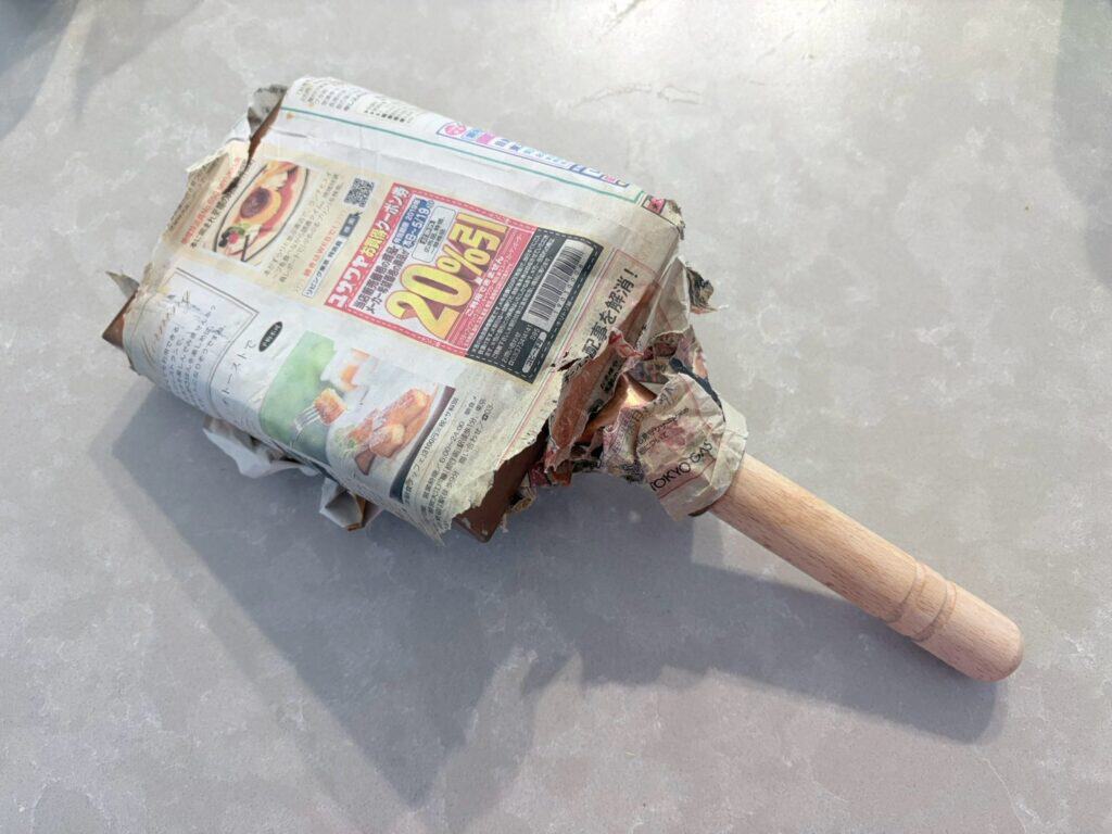 Copper tamagoyaki pan wrapped in newspaper for three years