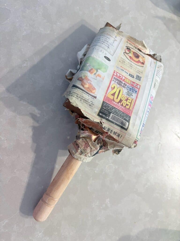 Copper tamagoyaki pan wrapped in newspaper for three years