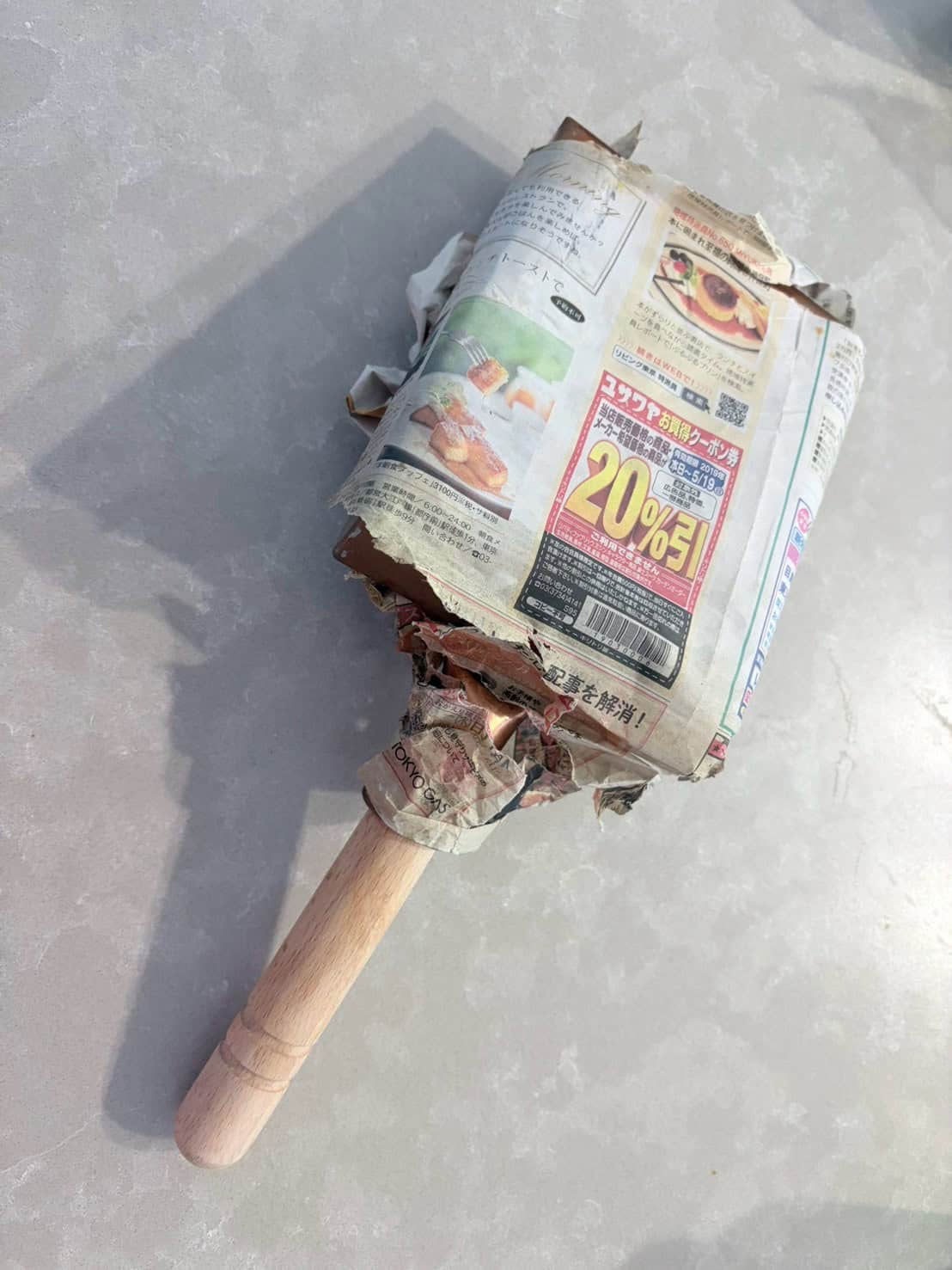 Copper tamagoyaki pan wrapped in newspaper for three years