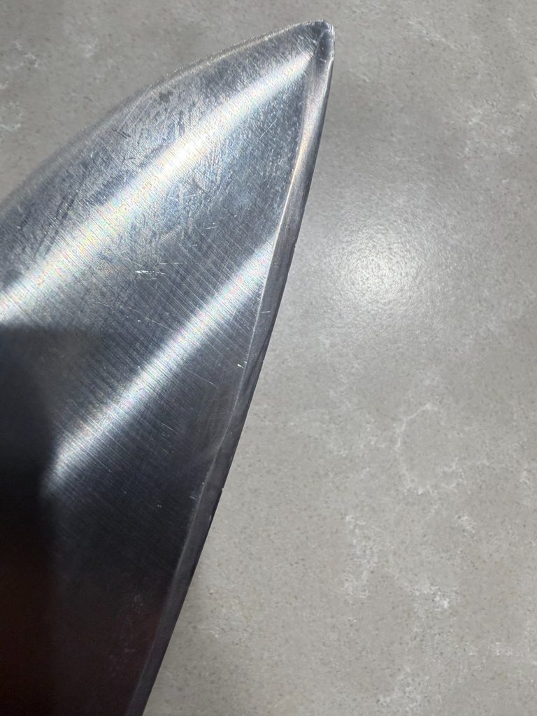 The tip of the knife after learning how to sharpen a japanese knife, chip still present